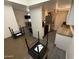 This modern kitchen includes stainless steel appliances and granite countertops at 4111 W Reade Ave, Phoenix, AZ 85019