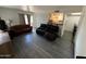 Spacious living room featuring hardwood floors and comfortable seating arrangements at 4111 W Reade Ave, Phoenix, AZ 85019