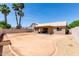 Spacious backyard surrounded by block fencing and desert landscaping at 423 W Century Ct, Gilbert, AZ 85233