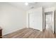 Clean bedroom with wood-look floors and a closet with sliding doors at 423 W Century Ct, Gilbert, AZ 85233