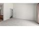 Bedroom with neutral carpet, a closet, and white walls at 423 W Century Ct, Gilbert, AZ 85233