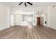 Bright, open-concept living area with wood flooring, soaring ceilings and a modern aesthetic at 423 W Century Ct, Gilbert, AZ 85233
