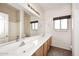 Spacious bathroom with double sinks, a large mirror, and a separate tub and shower at 4530 E White Feather Ln, Cave Creek, AZ 85331