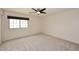 Bright bedroom with soft carpet, a window and a ceiling fan at 4530 E White Feather Ln, Cave Creek, AZ 85331