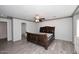 Bedroom with wood-look tile floors and a view of the entrance to the bathroom at 4530 E White Feather Ln, Cave Creek, AZ 85331