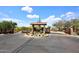 A gated community entrance with desert landscaping, offering security and exclusivity at 4530 E White Feather Ln, Cave Creek, AZ 85331