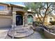 Charming two-story home features a tile roof, arched entryway, three-car garage and gated courtyard at 4530 E White Feather Ln, Cave Creek, AZ 85331