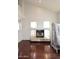 The living room boasts a modern fireplace with decorative mantle and rich wood floors at 4530 E White Feather Ln, Cave Creek, AZ 85331