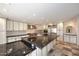 Well-equipped kitchen featuring a large island with sleek countertops, high-end stainless steel appliances and custom cabinetry at 4530 E White Feather Ln, Cave Creek, AZ 85331