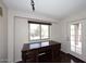 Home office with beautiful hardwood floors and a view of the backyard pool area at 4530 E White Feather Ln, Cave Creek, AZ 85331