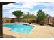 Backyard pool with a waterfall feature and desert landscaping at 4530 E White Feather Ln, Cave Creek, AZ 85331