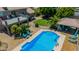 Relaxing backyard oasis with pool, sundeck and covered patio area featuring desert landscaping and inviting seating at 4648 W Misty Willow Ln, Glendale, AZ 85310