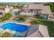 Beautiful backyard with a sparkling pool, spacious patio, desert landscaping, and plenty of room for outdoor entertaining at 4648 W Misty Willow Ln, Glendale, AZ 85310