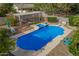 Aerial view of sparkling pool, spa, and covered patio in a backyard featuring mature desert landscaping at 4648 W Misty Willow Ln, Glendale, AZ 85310