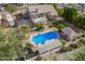 Stunning aerial view of home showcasing the pool, deck, landscaping, covered patio, and an area to park a RV at 4648 W Misty Willow Ln, Glendale, AZ 85310