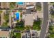 A bird's eye view of a home featuring a pool, RV parking, and a meticulously maintained yard with desert landscaping at 4648 W Misty Willow Ln, Glendale, AZ 85310