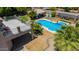 A high angle of a well maintained backyard features a pool, outdoor cabana, and an outdoor deck at 4648 W Misty Willow Ln, Glendale, AZ 85310