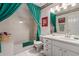 Well-lit bathroom with a tub, shower, and a vanity with bright lighting at 4648 W Misty Willow Ln, Glendale, AZ 85310