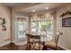 Cozy breakfast nook featuring lots of natural light and backyard views at 4648 W Misty Willow Ln, Glendale, AZ 85310