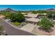 Aerial view of a well-maintained home with a three-car garage, pool, and landscaped yard at 4648 W Misty Willow Ln, Glendale, AZ 85310