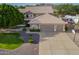 Lovely home with a large three car garage, well-manicured lawn, and RV parking on a corner lot at 4648 W Misty Willow Ln, Glendale, AZ 85310