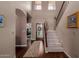 Elegant foyer features hardwood floors, a staircase, and plenty of natural light at 4648 W Misty Willow Ln, Glendale, AZ 85310