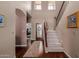 Elegant foyer features hardwood floors, a staircase, and plenty of natural light at 4648 W Misty Willow Ln, Glendale, AZ 85310