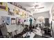 Home gym features cycling machines, exercise equipment, wall decor, and a ceiling fan at 4648 W Misty Willow Ln, Glendale, AZ 85310