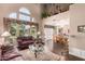 Inviting living space with large windows overlooking the pool and dining area at 4648 W Misty Willow Ln, Glendale, AZ 85310