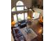 This living room offers great natural light, a ceiling fan, and elegant decor at 4648 W Misty Willow Ln, Glendale, AZ 85310