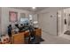 Well-equipped home office with multiple screens, storage, and a view at 4648 W Misty Willow Ln, Glendale, AZ 85310