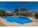 Inviting backyard pool with cabana, pergola and a diving board at 4648 W Misty Willow Ln, Glendale, AZ 85310