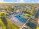 Aerial view showcasing community amenities including a pool, tennis courts and green spaces at 4725 E Brown Rd # 13, Mesa, AZ 85205