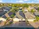 Stunning aerial view of a well-maintained home in a quiet neighborhood with mature trees and desert landscaping at 4725 E Brown Rd # 13, Mesa, AZ 85205