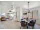 Elegant dining area with contemporary lighting, stylish decor, and an open view into the spacious living room at 4725 E Brown Rd # 13, Mesa, AZ 85205