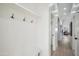 Hallway features a built in coat rack bench with white panelling and access to the rest of the home at 4725 E Brown Rd # 13, Mesa, AZ 85205