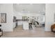Bright, open-concept kitchen with white cabinets, stainless steel appliances, and an eat-in island at 4725 E Brown Rd # 13, Mesa, AZ 85205