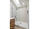 Modern frameless shower with stylish tile, skylight, and sleek fixtures, offering a spa-like experience at 4725 E Brown Rd # 13, Mesa, AZ 85205