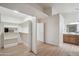 Spacious walk-in closet with built-in shelving and a view into the ensuite bathroom, offers ample storage at 4725 E Brown Rd # 13, Mesa, AZ 85205