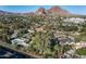 Aerial view of property, showing mountain views, the surrounding neighborhood, and lush landscaping at 5112 N 41St St, Phoenix, AZ 85018