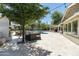 A lush backyard features mature trees, an outdoor kitchen, and a pool at 5112 N 41St St, Phoenix, AZ 85018