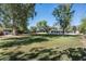 Expansive backyard with lush lawn and mature trees, providing a private and tranquil oasis at 5112 N 41St St, Phoenix, AZ 85018