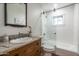 Bathroom showcasing tiled tub/shower combo with vanity and granite countertop at 5112 N 41St St, Phoenix, AZ 85018