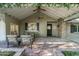 Inviting covered patio with cozy seating and brick flooring, perfect for enjoying the outdoors at 5112 N 41St St, Phoenix, AZ 85018
