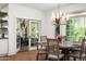 Elegant dining room with a round table, chandelier, and doors to an outdoor patio, perfect for entertaining at 5112 N 41St St, Phoenix, AZ 85018
