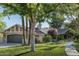 Charming single story home with mature trees, lush lawn, and unique stone and brick accents on a sunny day at 5112 N 41St St, Phoenix, AZ 85018