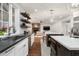 Gourmet kitchen with sleek countertops, stainless steel appliances, and seamless flow into the living area at 5112 N 41St St, Phoenix, AZ 85018