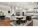 Open-concept kitchen with dual islands and seating, seamlessly connected to a recreational area with a pool table at 5112 N 41St St, Phoenix, AZ 85018
