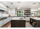 Bright kitchen featuring double islands, stainless appliances, and views leading into the dining and living areas at 5112 N 41St St, Phoenix, AZ 85018