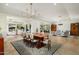 Spacious living area with light wood flooring, seamlessly integrating the dining, office, and lounge spaces at 5112 N 41St St, Phoenix, AZ 85018